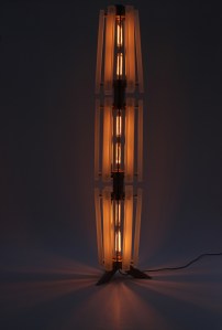 Sculpture lit at night on white background